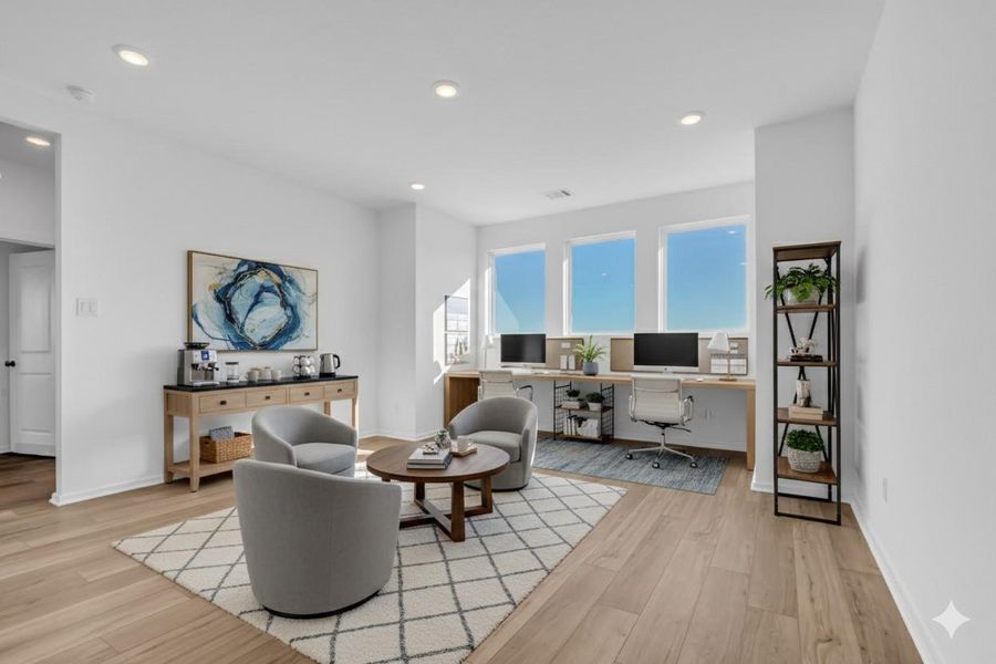 Game Room / Flex Space (Virtually Staged): Shown as a work-from-home setup with seating and lounge area to illustrate the scale and versatility of this oversized space. Game Room / Flex Space (Virtually Staged): Shown as a work-from-home setup with seating and lounge area to illustrate the scale and versatility of this oversized space.