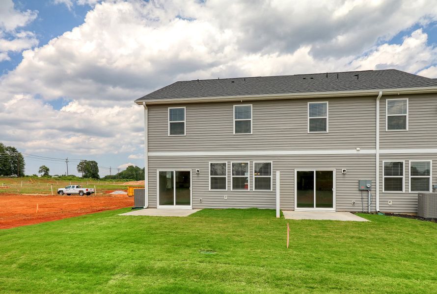 Representative exterior photo of a completed home built from the Raycord by Hunter Quinn Homes in Westgate Village Townes, Spartanburg, SC (Image 21). Representative exterior photo of a completed home built from the Raycord by Hunter Quinn Homes in Westgate Village Townes, Spartanburg, SC (Image 21).