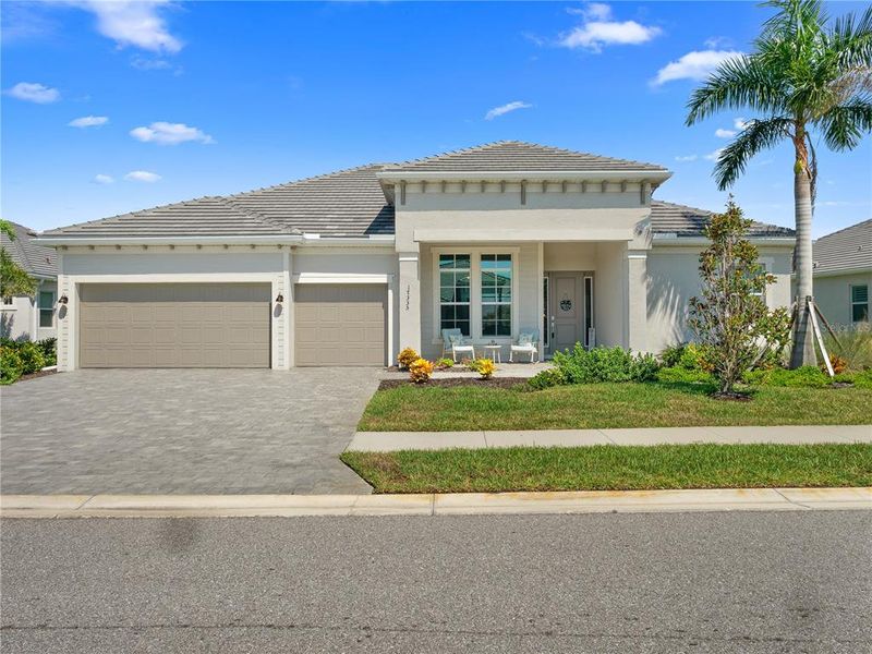 Front exterior of a new home in , Venice, FL, highlighting curb appeal (Image 27). Front exterior of a new home in , Venice, FL, highlighting curb appeal (Image 27).