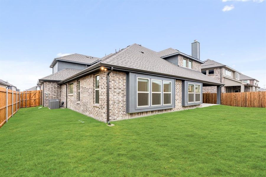 Exterior details and patio area of a home in West Crossing, Anna (Image 3). Exterior details and patio area of a home in West Crossing, Anna (Image 3).
