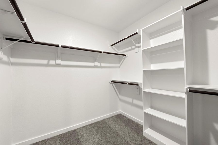 A stylish walk-in closet awaits, providing ample storage for your wardrobe and a little extra room for those cherished items. A stylish walk-in closet awaits, providing ample storage for your wardrobe and a little extra room for those cherished items.