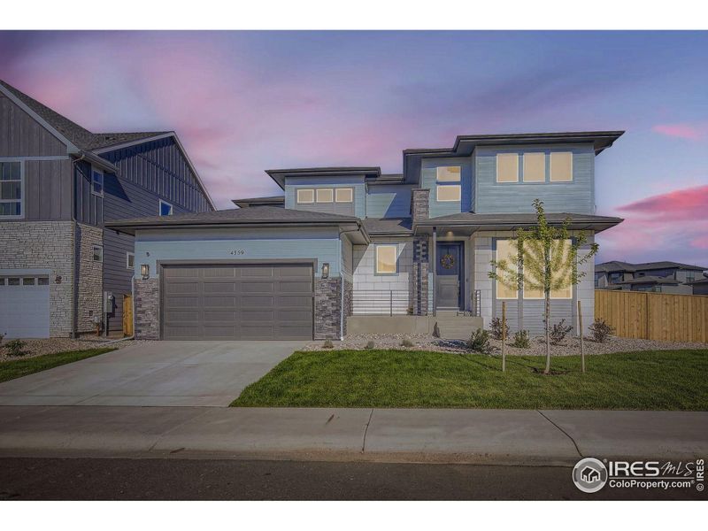 Front exterior of a new home in , Timnath, CO, highlighting curb appeal (Image 19).