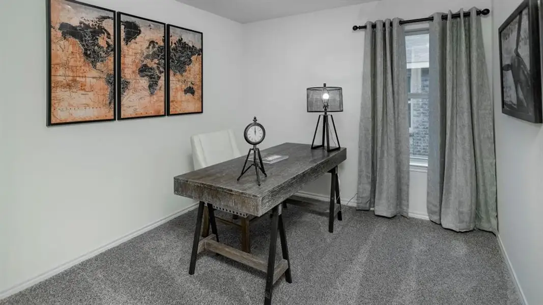 Neutral-toned room featuring a single window with curtain rod and drapes, light gray carpeting, and white baseboards