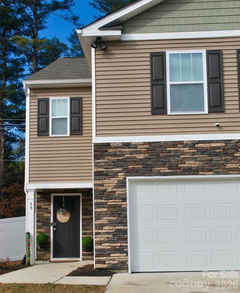 Front exterior of a new home in , Hendersonville, NC, highlighting curb appeal (Image 2). Front exterior of a new home in , Hendersonville, NC, highlighting curb appeal (Image 2).