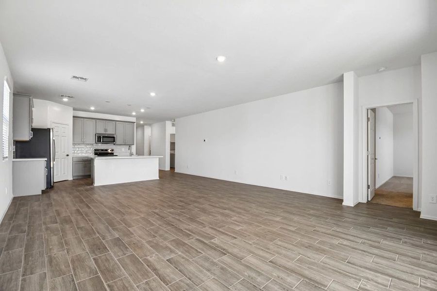 Great room, dining and kitchen. Not actual home, finishes and options may vary. Great room, dining and kitchen. Not actual home, finishes and options may vary.