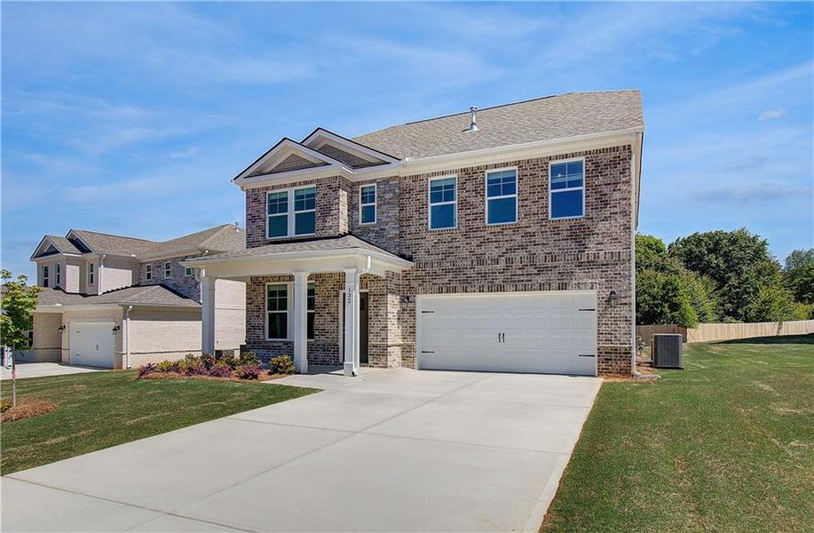 Front exterior of a new home in Burchwood, Stockbridge, GA, highlighting curb appeal (Image 2). Front exterior of a new home in Burchwood, Stockbridge, GA, highlighting curb appeal (Image 2).