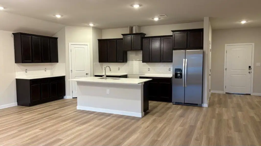 Furnished interior view inside a new home in King's Landing, Corpus Christi (Image 4).