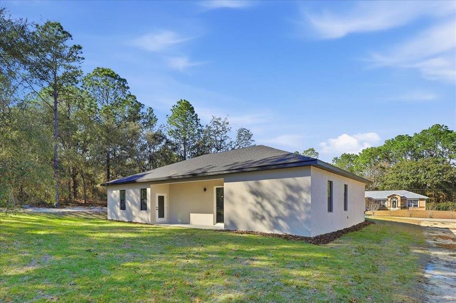 Exterior details and patio area of a home in , Citrus Springs (Image 17).