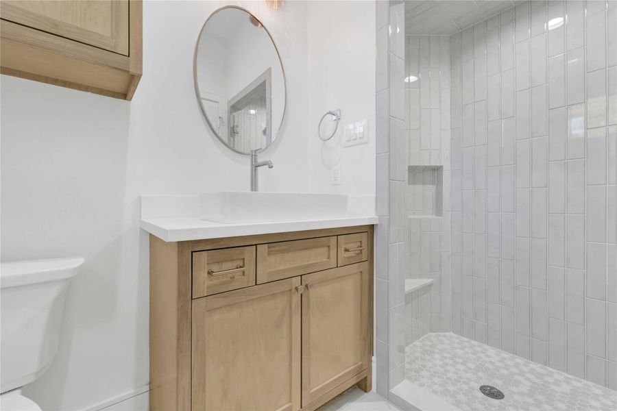 First floor full bathroom with custom finishes.