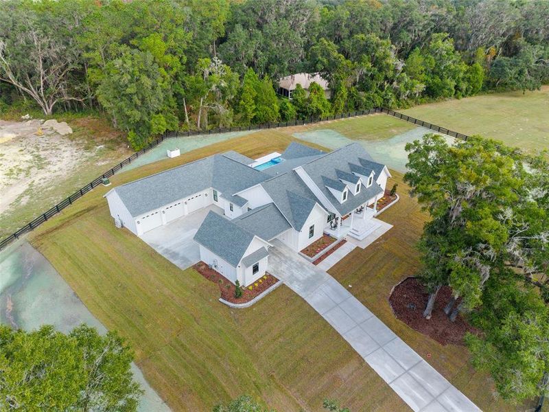 Front exterior of a new home in , Newberry, FL, highlighting curb appeal (Image 28). Front exterior of a new home in , Newberry, FL, highlighting curb appeal (Image 28).