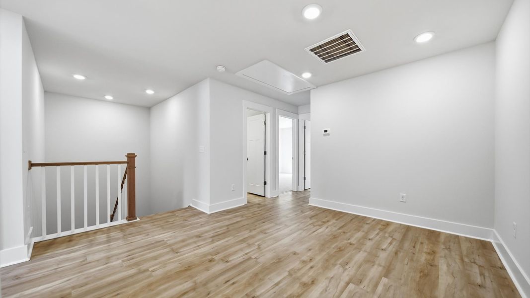 Bright loft with hardwood flooring and a comfortable setting for entertaining or quiet evenings Bright loft with hardwood flooring and a comfortable setting for entertaining or quiet evenings