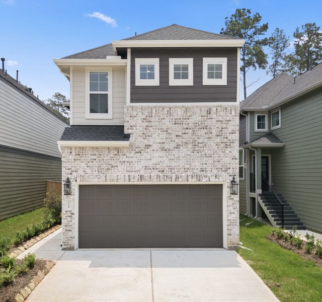 Front exterior of a new home in The Woodlands Hills, Willis, TX, highlighting curb appeal (Image 26). Front exterior of a new home in The Woodlands Hills, Willis, TX, highlighting curb appeal (Image 26).