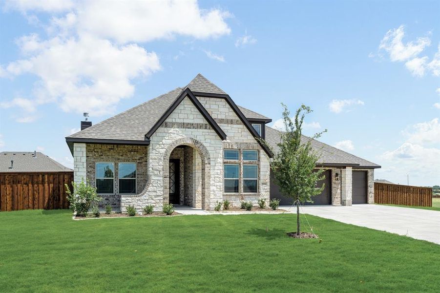 Front exterior of a new home in Wildcat Ridge Phase 2 and 4, Godley, TX, highlighting curb appeal (Image 23). Front exterior of a new home in Wildcat Ridge Phase 2 and 4, Godley, TX, highlighting curb appeal (Image 23).