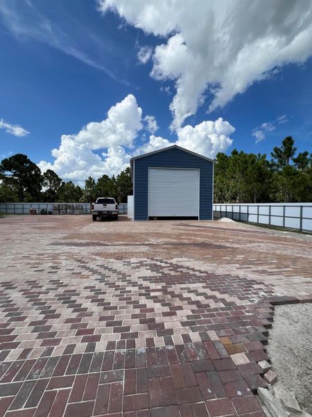 Front exterior of a new home in , Palm Bay, FL, highlighting curb appeal (Image 22).