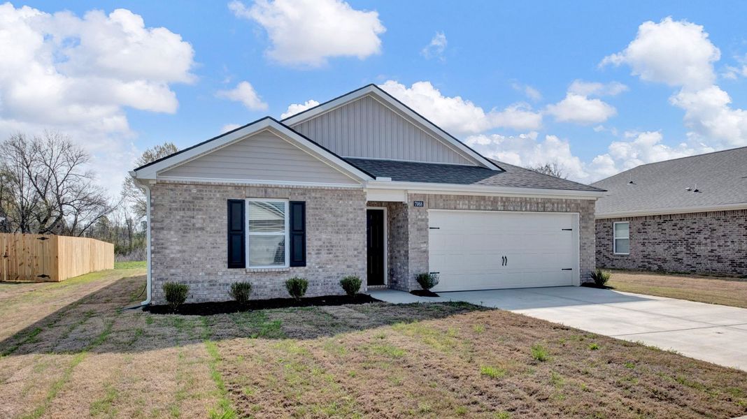 Front exterior of a new home in Huntington Estates, Millington, TN, highlighting curb appeal (Image 2).