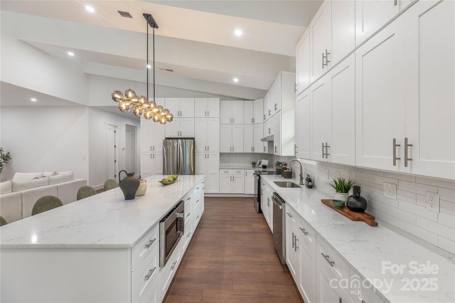 Kitchen Area with floor to ceiling cabinets and abundant counter space