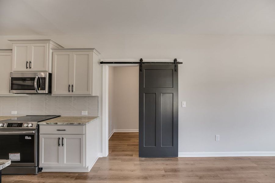 Furnished interior view inside a new home in LOVVORN ESTATES, Carrollton (Image 8).