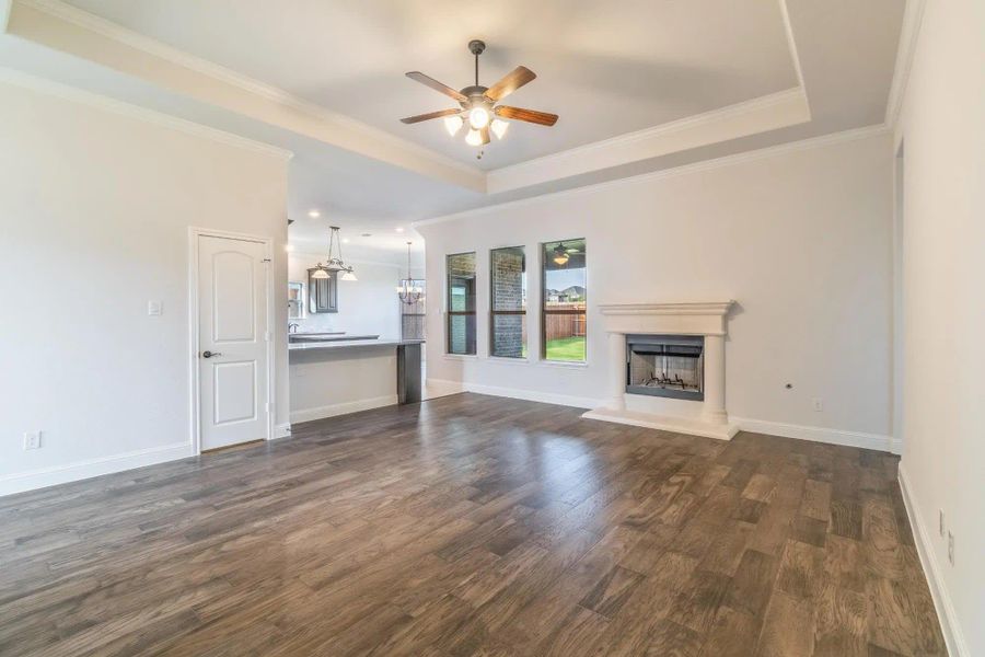 Living Room & Kitchen | Concept 2027 at Abe's Landing in Granbury, TX by Landsea Homes