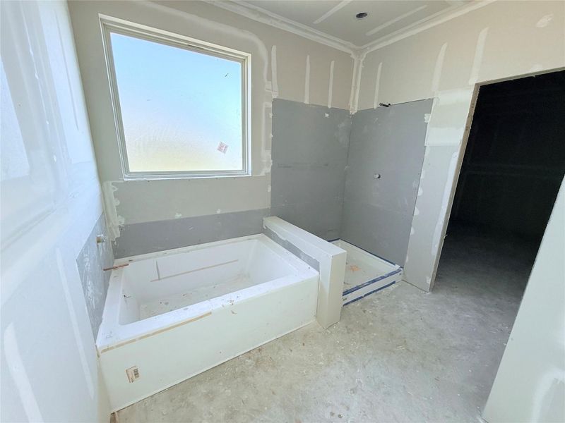 soaker tub and separate shower with huge walk in closet