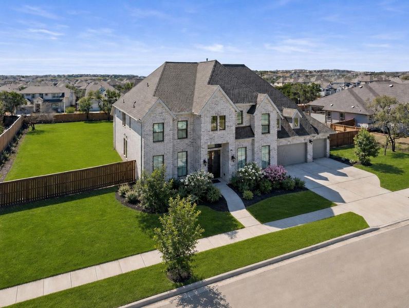 A spacious suburban home with well-kept landscaping, offering generous outdoor living space and ample parking. A spacious suburban home with well-kept landscaping, offering generous outdoor living space and ample parking.