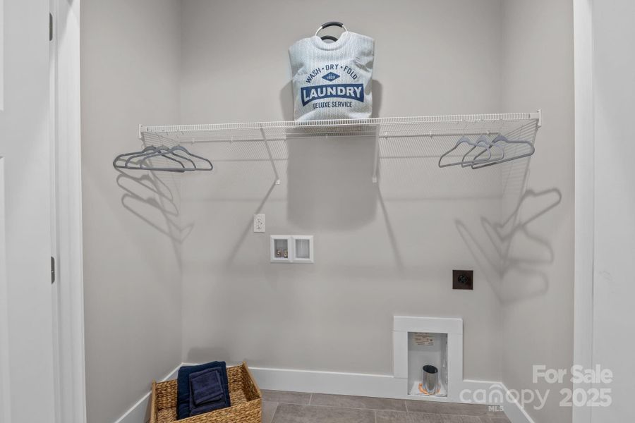 Clean and functional laundry room with space for everyday tasks.