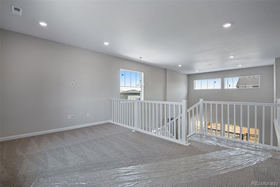 Spacious, unfurnished interior of a new home in Ensemble at The Aurora Highlands, Aurora (Image 27).