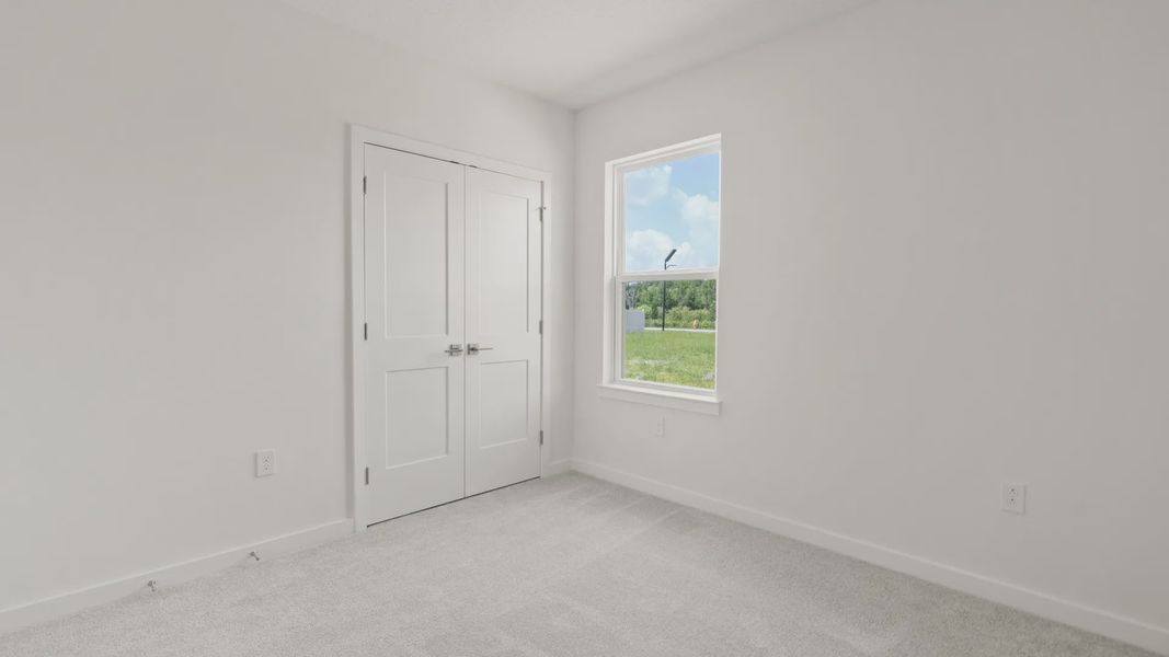 Furnished interior view inside a new home in Grasslands West, Lakeland (Image 29).