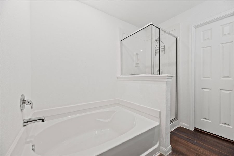 Soaking tub and separate shower in the primary bathroom. Soaking tub and separate shower in the primary bathroom.