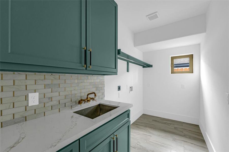 Laundry day just got brighter in this gorgeous utility room with a sink & plenty of cabinet space Laundry day just got brighter in this gorgeous utility room with a sink & plenty of cabinet space