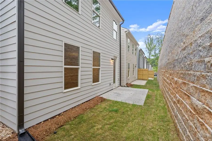 Exterior details and patio area of a home in The Village at Shallowford, Kennesaw (Image 3).