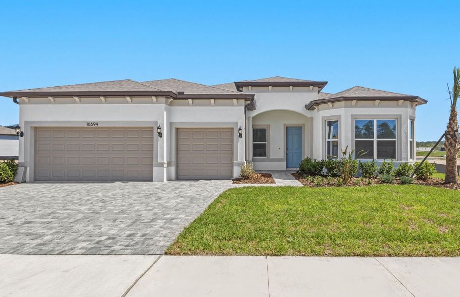 Front exterior of a new home in Del Webb River Reserve, Spring Hill, FL, highlighting curb appeal (Image 1). Front exterior of a new home in Del Webb River Reserve, Spring Hill, FL, highlighting curb appeal (Image 1).