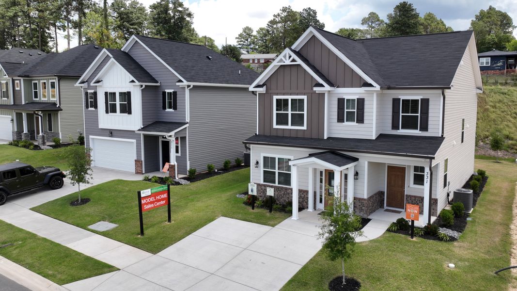 Front exterior of a new home in Forrest Bluff, North Augusta, SC, highlighting curb appeal (Image 22). Front exterior of a new home in Forrest Bluff, North Augusta, SC, highlighting curb appeal (Image 22).