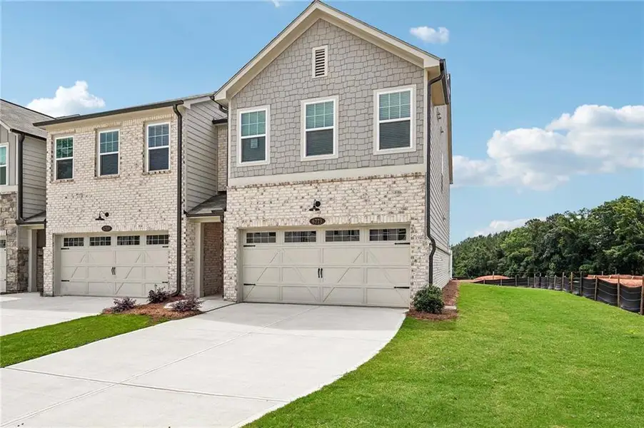 Front exterior of a new home in Leydenview, Mableton, GA, highlighting curb appeal (Image 2). Front exterior of a new home in Leydenview, Mableton, GA, highlighting curb appeal (Image 2).