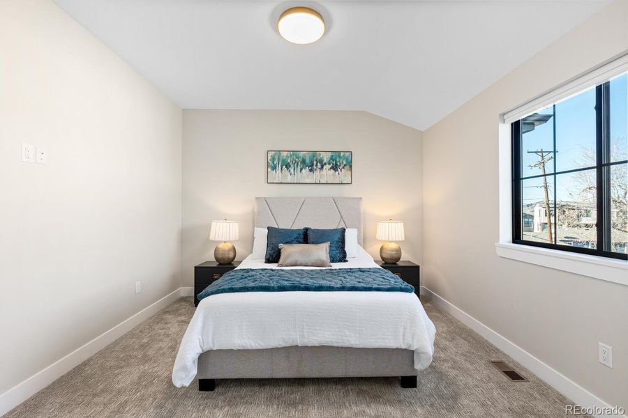 Secondary bedroom flooded with natural light Secondary bedroom flooded with natural light