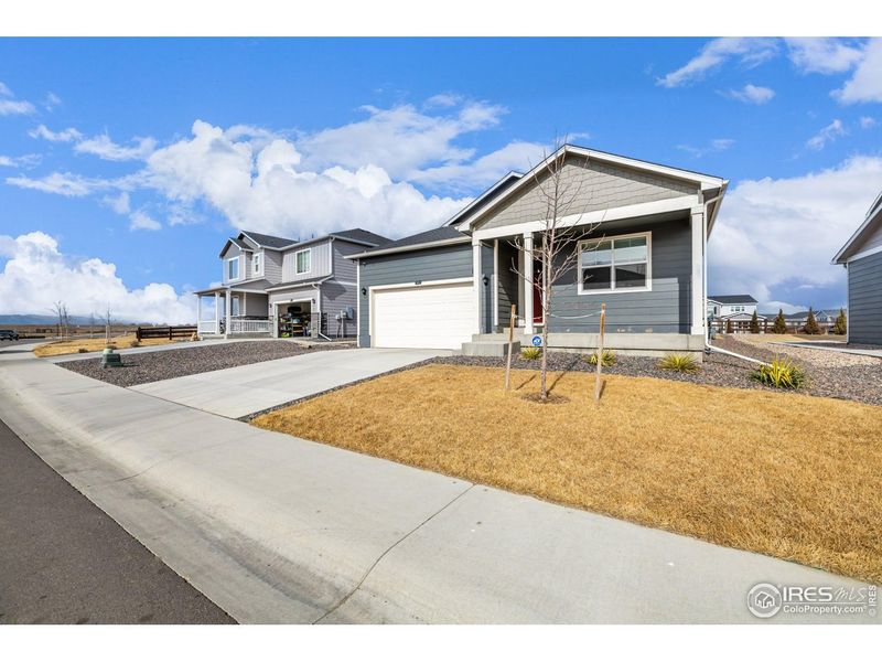 Front exterior of a new home in Fossil Creek Ranch, Windsor, CO, highlighting curb appeal (Image 22). Front exterior of a new home in Fossil Creek Ranch, Windsor, CO, highlighting curb appeal (Image 22).