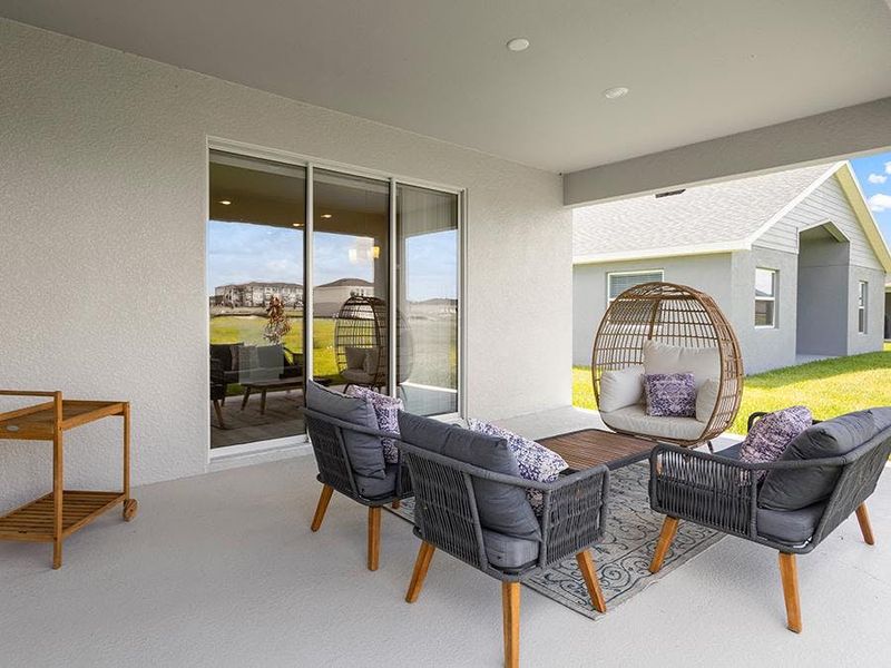 A triple slider opens the interior to desirable outdoor living space - Aubrey by Highland Homes A triple slider opens the interior to desirable outdoor living space - Aubrey by Highland Homes