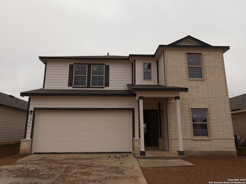 Front exterior of a new home in Meadows at Clear Springs, New Braunfels, TX, highlighting curb appeal (Image 18).