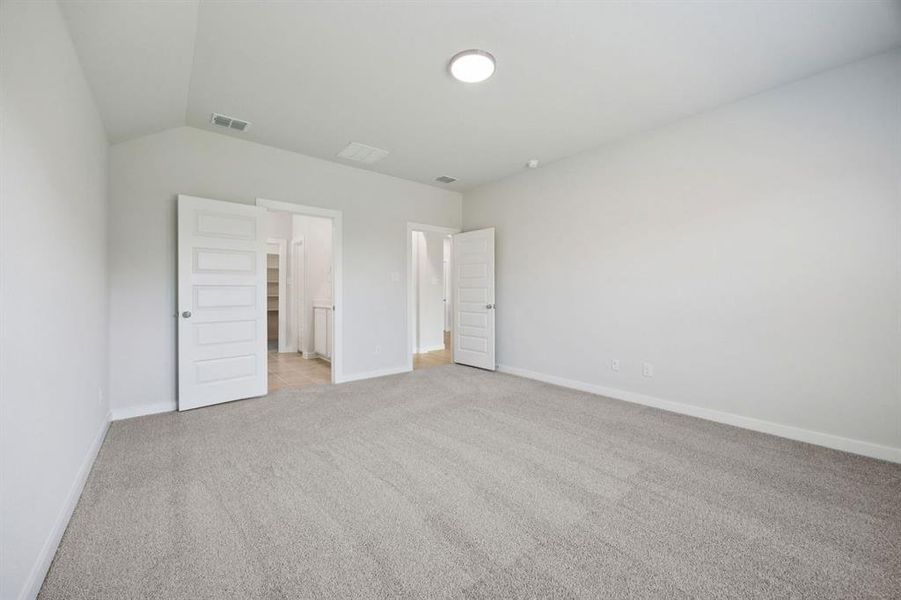 Primary Suite in the Heisman home plan by Trophy Signature Homes – REPRESENTATIVE PHOTO