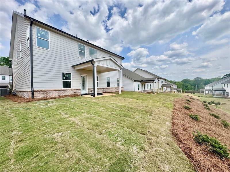 Exterior details and patio area of a home in Eastlyn Crossing, Flowery Branch (Image 3).