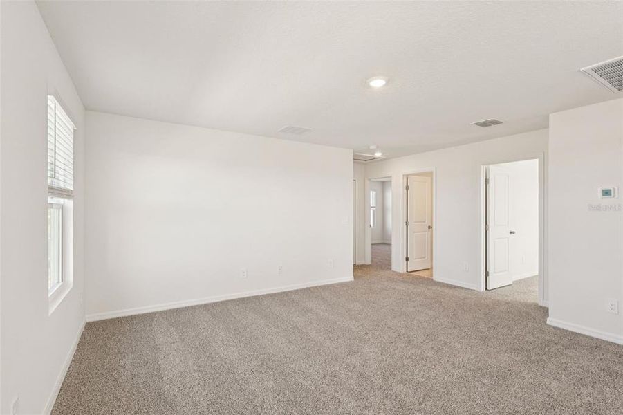 Spacious, unfurnished interior of a new home in The Reserve at Hammock Oaks - Classic Series, Lady Lake (Image 13).