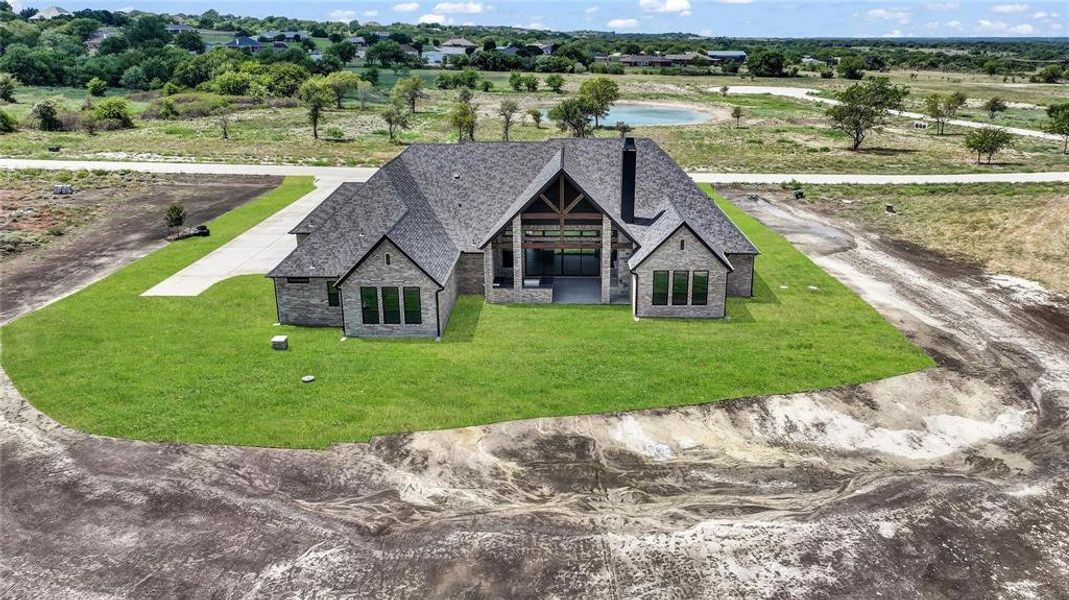 Front exterior of a new home in , Aledo, TX, highlighting curb appeal (Image 23). Front exterior of a new home in , Aledo, TX, highlighting curb appeal (Image 23).
