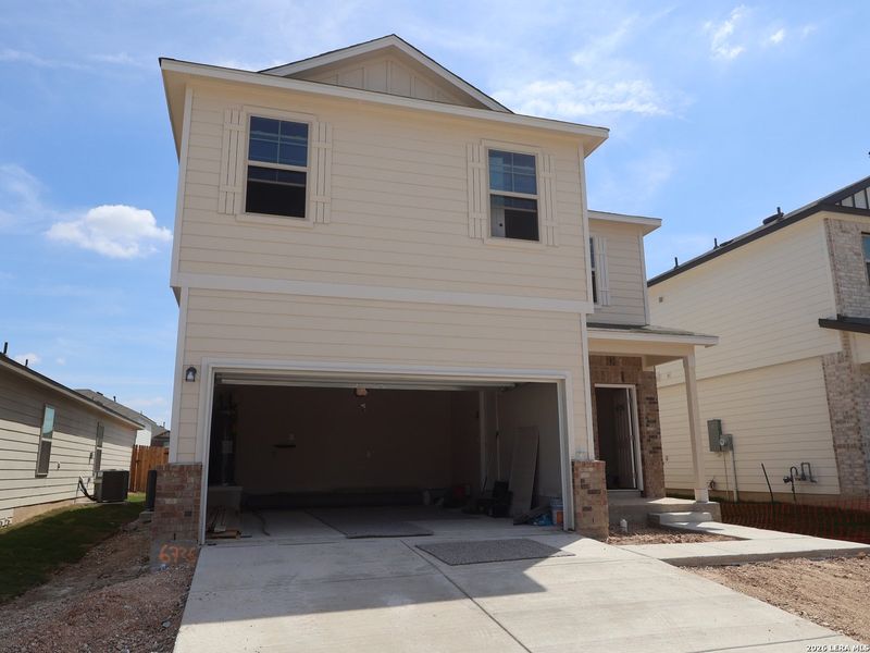 Front exterior of a new home in Winding Brook, San Antonio, TX, highlighting curb appeal (Image 1). Front exterior of a new home in Winding Brook, San Antonio, TX, highlighting curb appeal (Image 1).