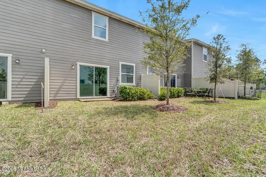 Exterior details and patio area of a home in Orchard Park Townhomes, St. Augustine (Image 1). Exterior details and patio area of a home in Orchard Park Townhomes, St. Augustine (Image 1).