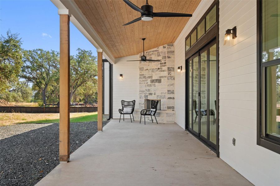 Private backyard retreat with a covered patio and tranquil greenbelt views.