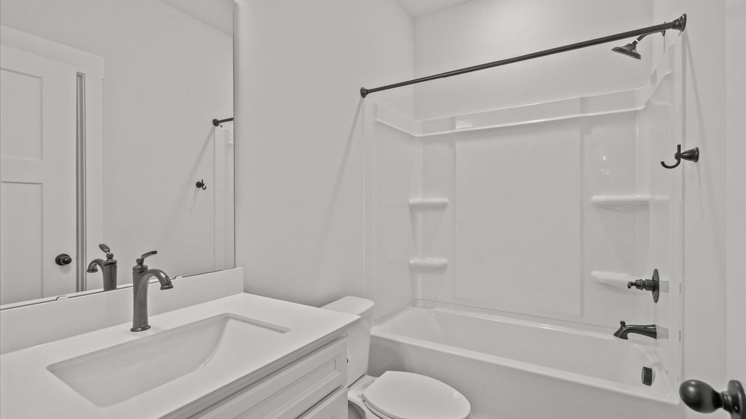 Memorable guest bath with refined tilework and a fresh, inviting feel