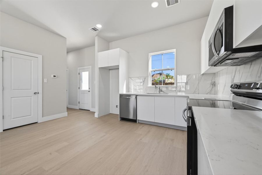 Furnished interior view inside a new home in Metro Village, Houston (Image 4).