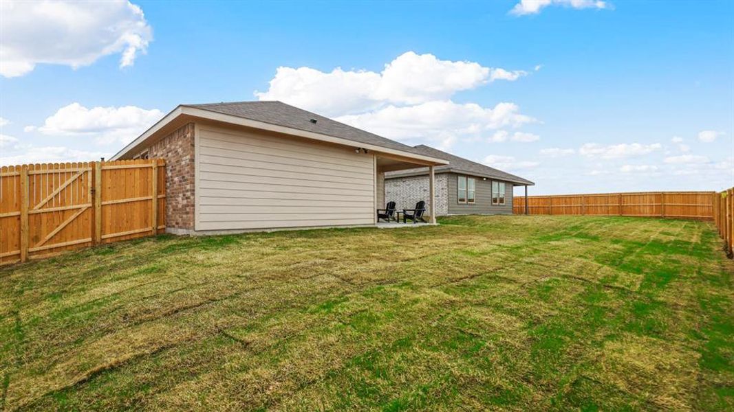 Exterior details and patio area of a home in Monarch at the Meadows, Ponder (Image 12). Exterior details and patio area of a home in Monarch at the Meadows, Ponder (Image 12).