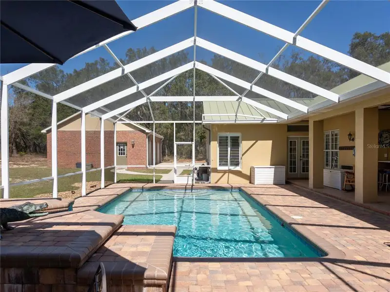 Exterior details and patio area of a home in , Ocklawaha (Image 3).