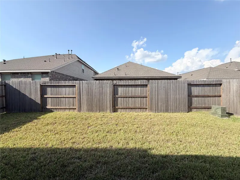 Exterior details and patio area of a home in Sunterra, Katy (Image 3).