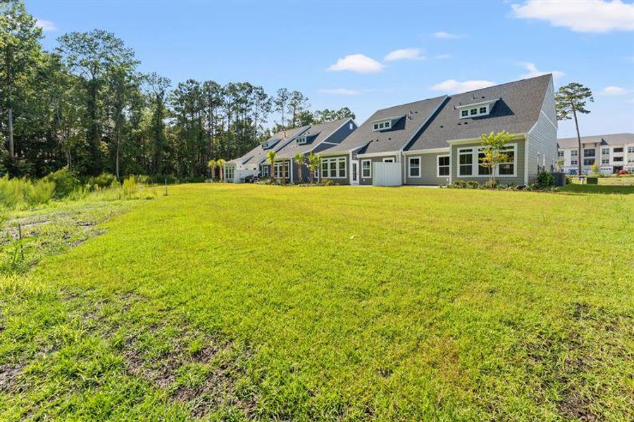 Exterior details and patio area of a home in Grande Dunes North Village, Myrtle Beach (Image 4).